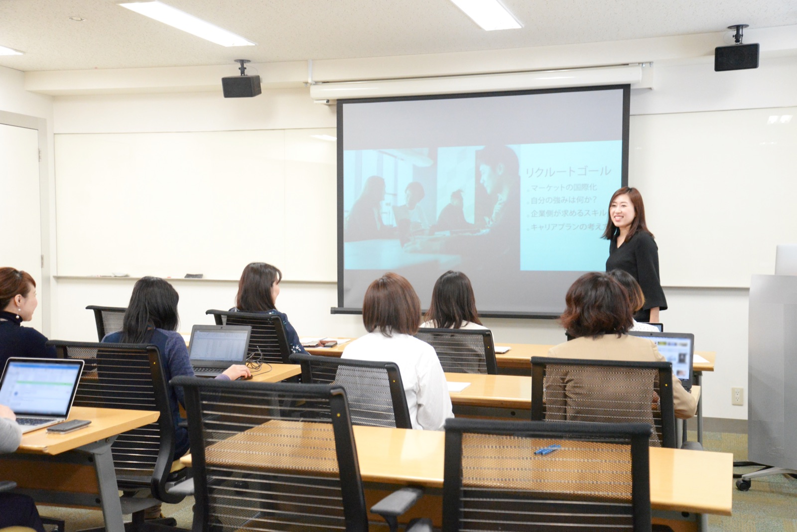 Instructor presenting to a class in a training room